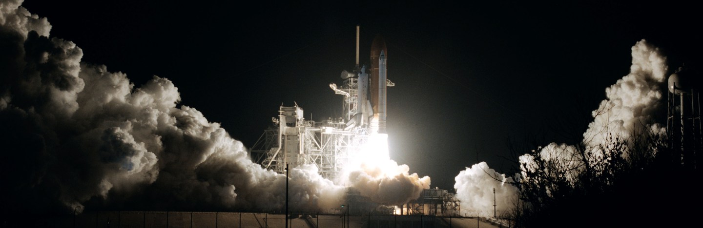 space shuttle Columbia launching at night